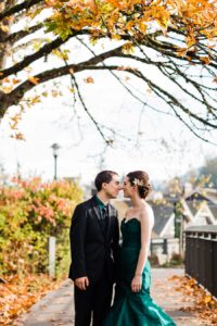 A bride and groom take photos on a crisp autumn day with mountain wedding photographer Amy GalbraithA bride and groom take photos on a crisp autumn day with mountain wedding photographer Amy Galbraith