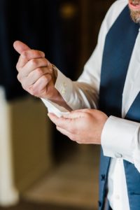 Groom getting ready for his Jackson Hole wedding at Grand Targhee Resort by Amy Galbraith
