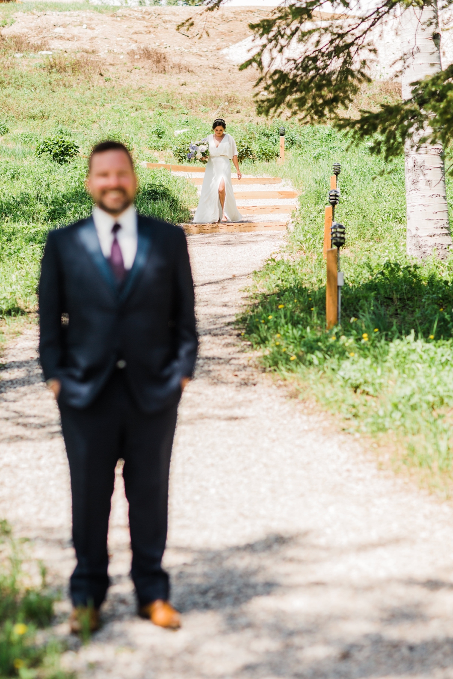Groom waiting for his bride among the aspen trees at Grand Targhee Resort by Jackson Hole wedding photographer Amy Galbraith
