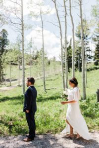 First look in the aspen grove at Grand Targhee Resort by Jackson Hole wedding photographer Amy Galbraith