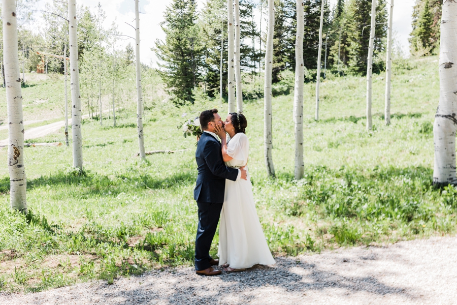 First look in the aspen grove at Grand Targhee Resort by Jackson Hole wedding photographer Amy Galbraith