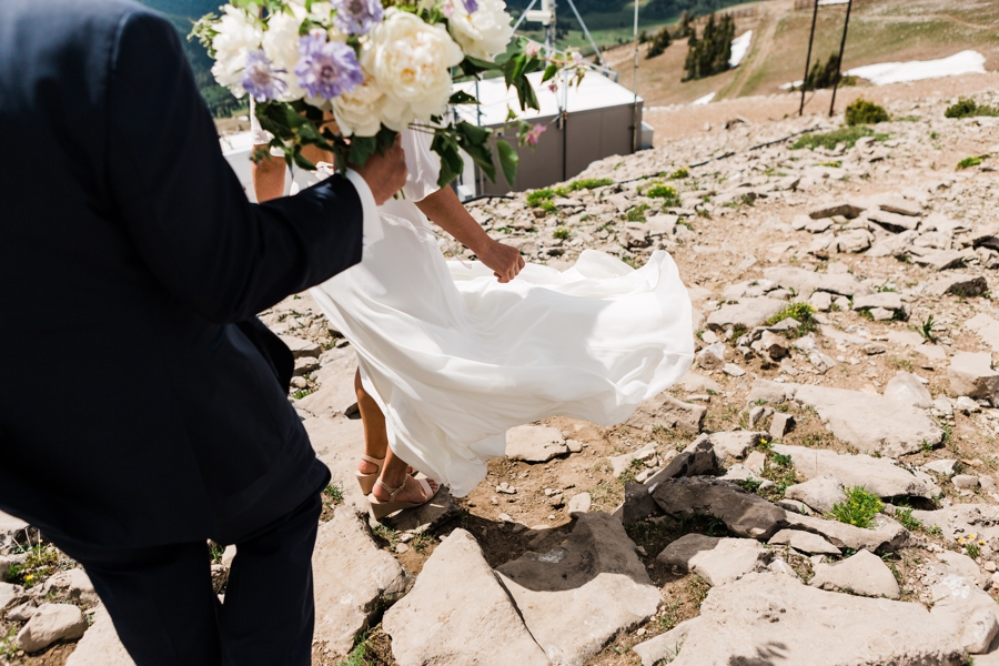 Bride's dress blows in the wind at Grand Targhee Resort in Jackson Hole