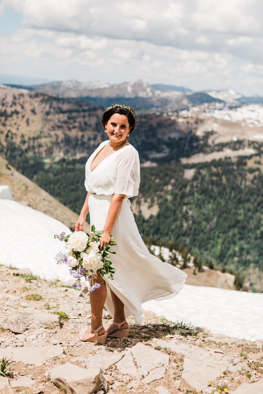 Bride on a mountaintop at her Jackson Hole wedding at Grand Targhee Resort
