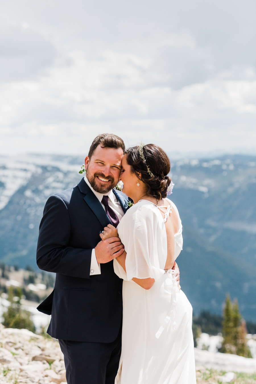 Bride and groom laugh together during their photos at Grand Targhee Resort by Jackson Hole wedding photographer Amy Galbraith