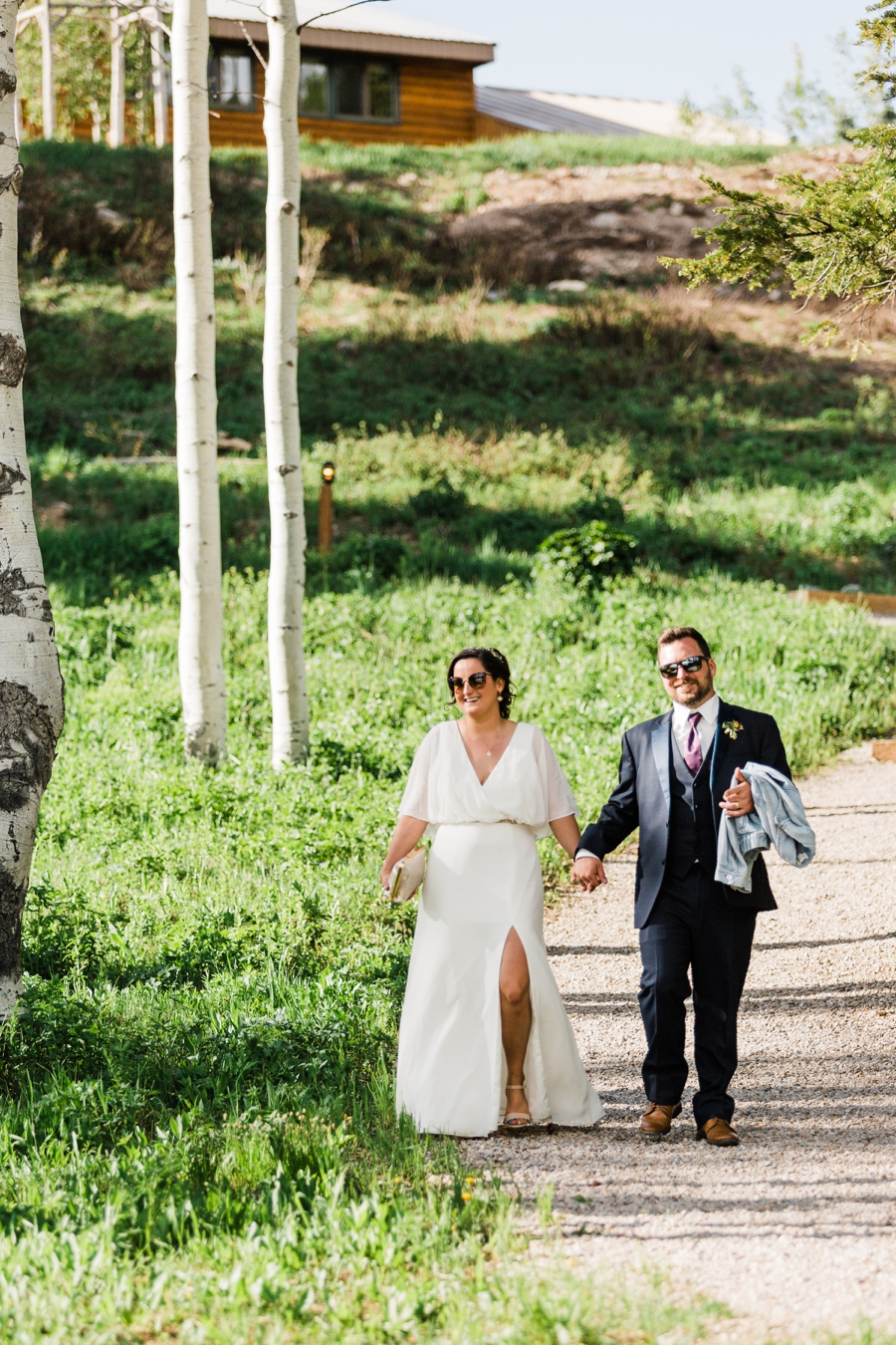 Bride and groom walk into their reception at Grand Targhee Resort in Wyoming