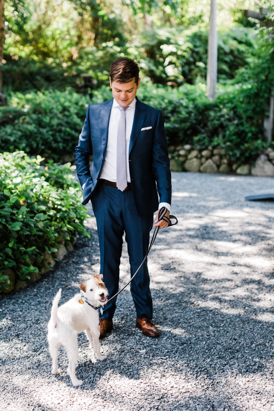 Groom with his dog on his wedding day