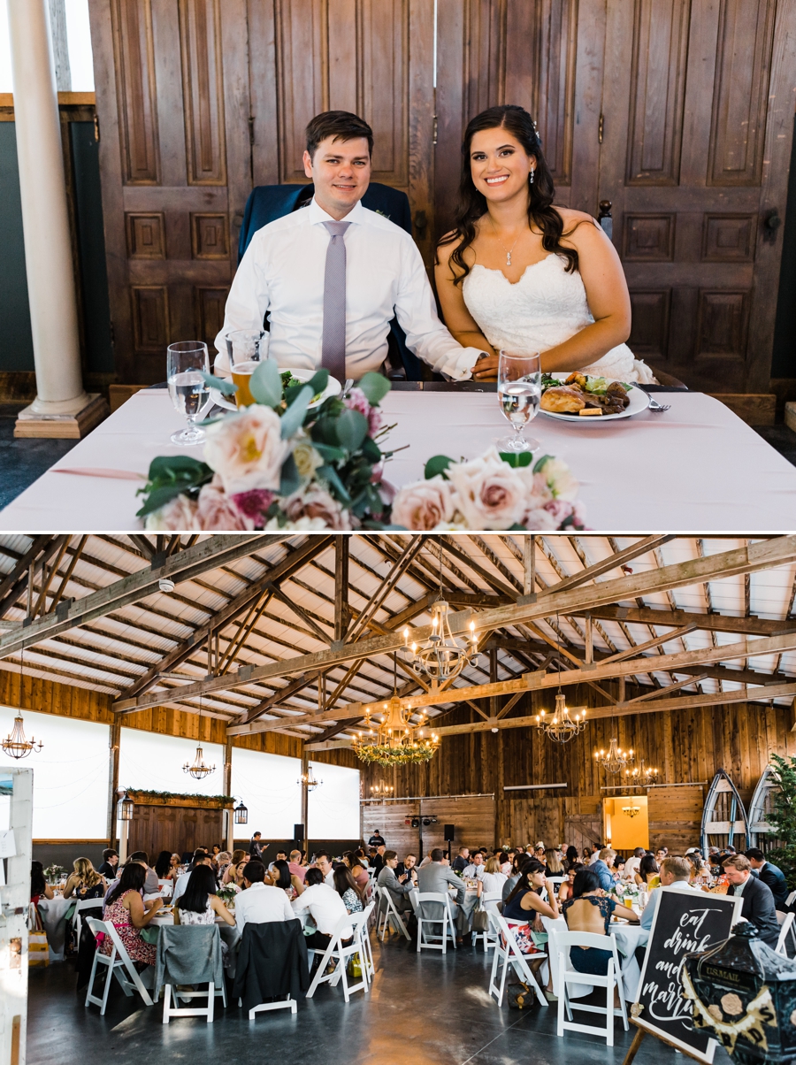 A bride and groom enjoy their barn reception at Green Gates at Flowing Lake in Snohomish, Washington by Seattle wedding photographer Amy Galbraith