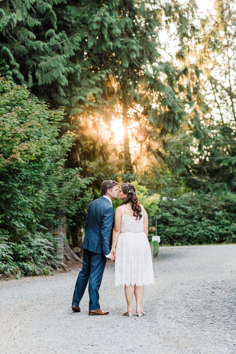 A bride and groom pose for photos on a hot summer day during their wedding at Green Gates at Flowing Lake by Seattle wedding photographer Amy Galbraith