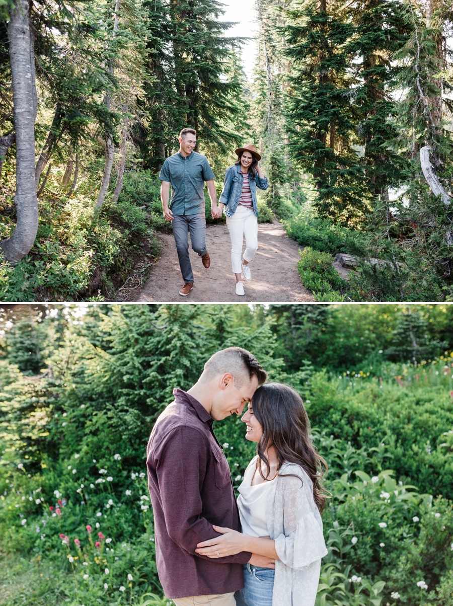 A couple strolls along a trail together during their Mt Rainier engagement session with wildflowers