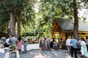 A wedding reception at beautiful outdoor wedding venue Green Gates at Flowing Lake in Snohomish by Seattle mountain wedding photographer Amy Galbraith