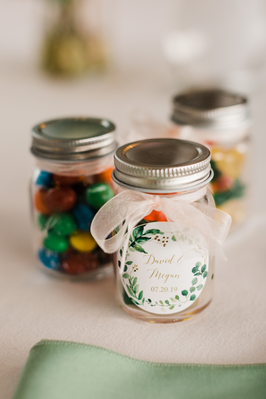 Edible wedding favors served in glass jars photographed by outdoor wedding photographer Amy Galbraith