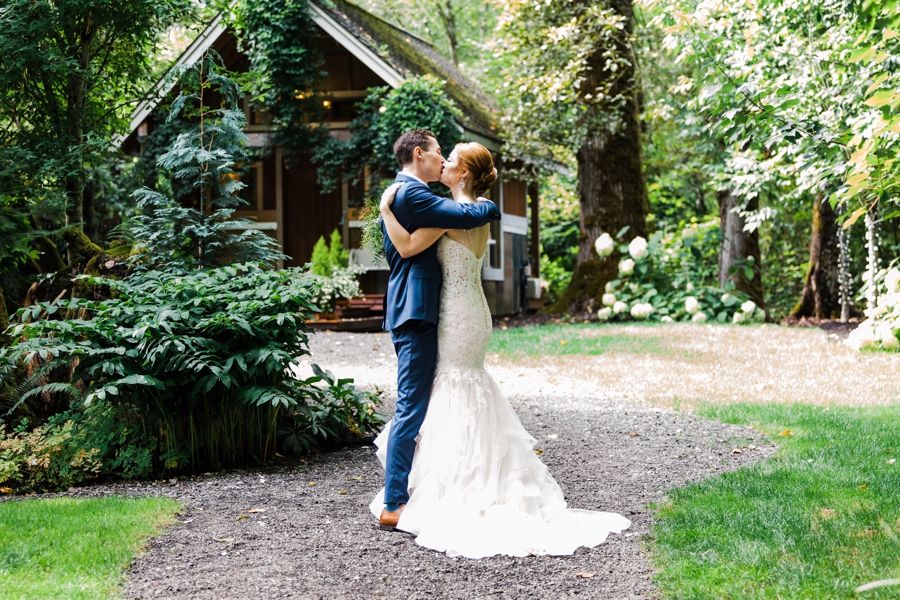 A bride and groom embrace after their wedding ceremony at Maroni Meadows by Seattle wedding photographer Amy Galbraith