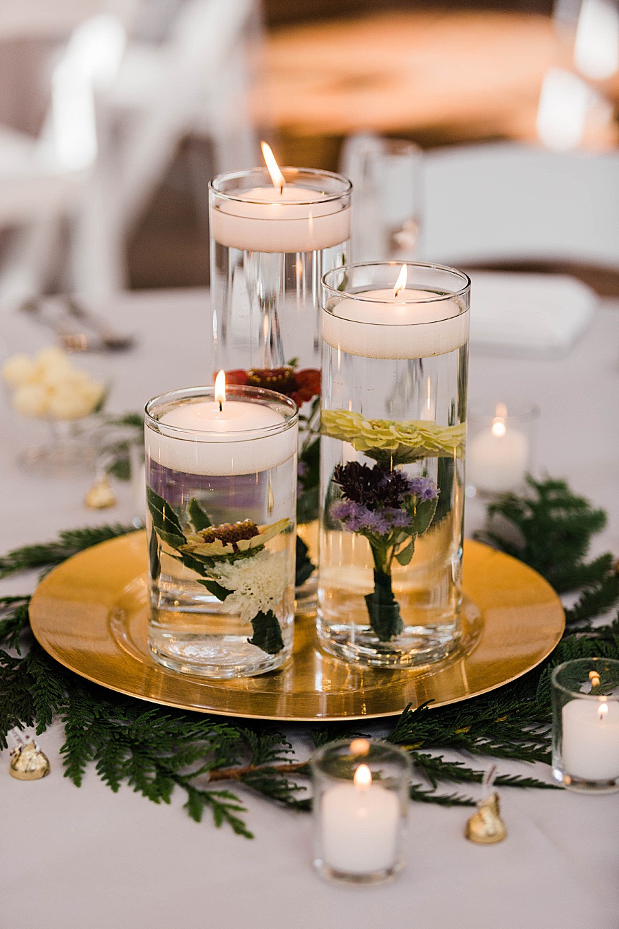 floating candles with flowers at a green and gold wedding at Kiana Lodge in Washington