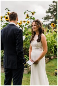 Vow reading during a Camano Island elopement photographed by Amy Galbraith