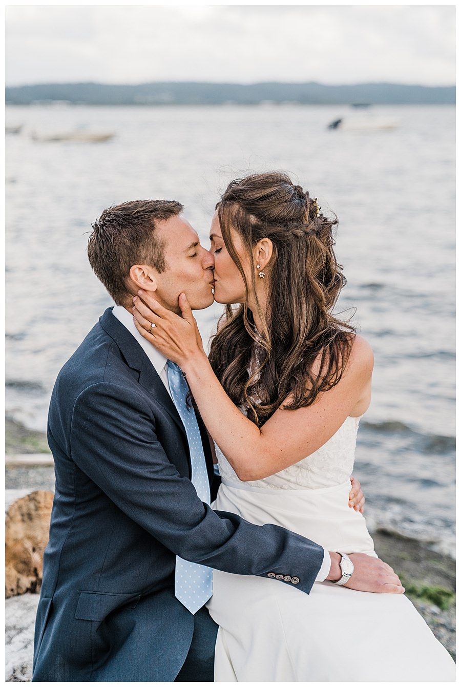 A bride and groom kiss after their Camano Island elopement photographed by Amy Galbraith