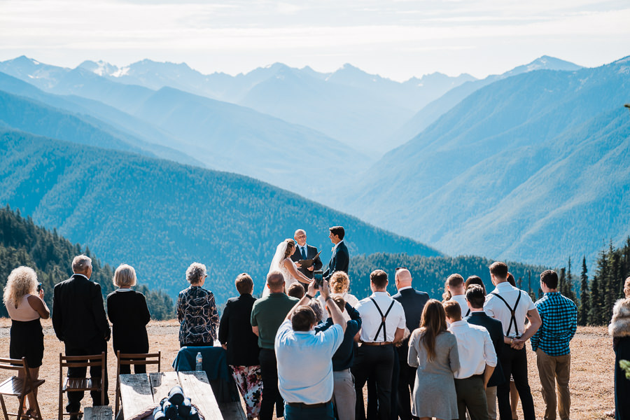 a couple says their vows with a small group of guests on top of Hurricane Ridge in Olympic National Park