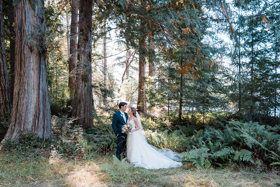 A couple enjoys each other's company in the woods after eloping in Olympic National Park