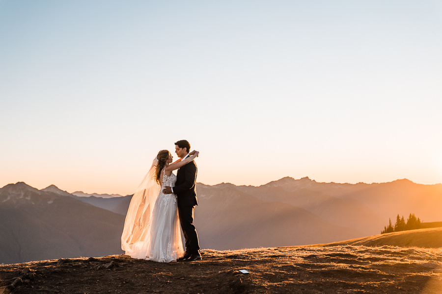 A couple has their first dance at sunset on Hurricane Ridge while eloping in Olympic National Park