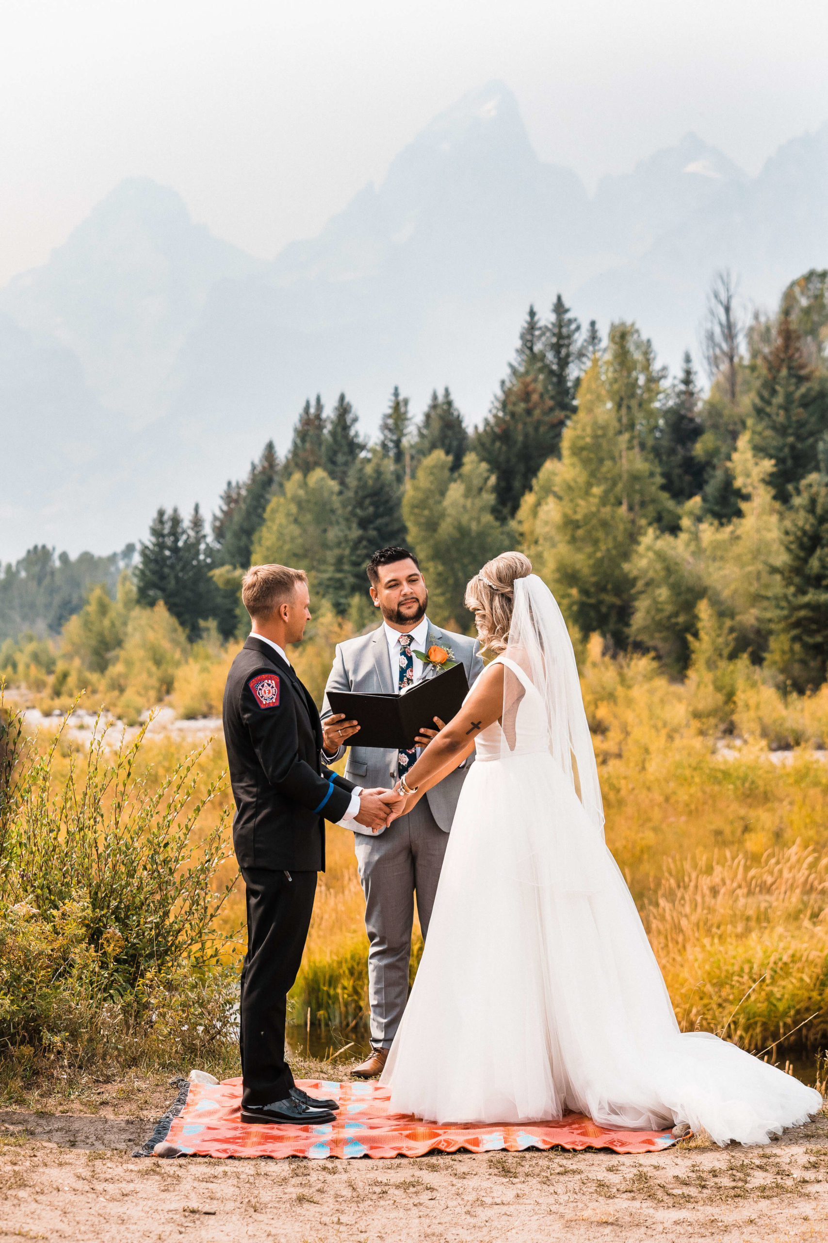 Bride and groom exchanging vows at their elopement location in Washington