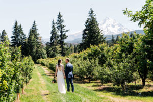 Bride and groom down a trail for their PNW elopement