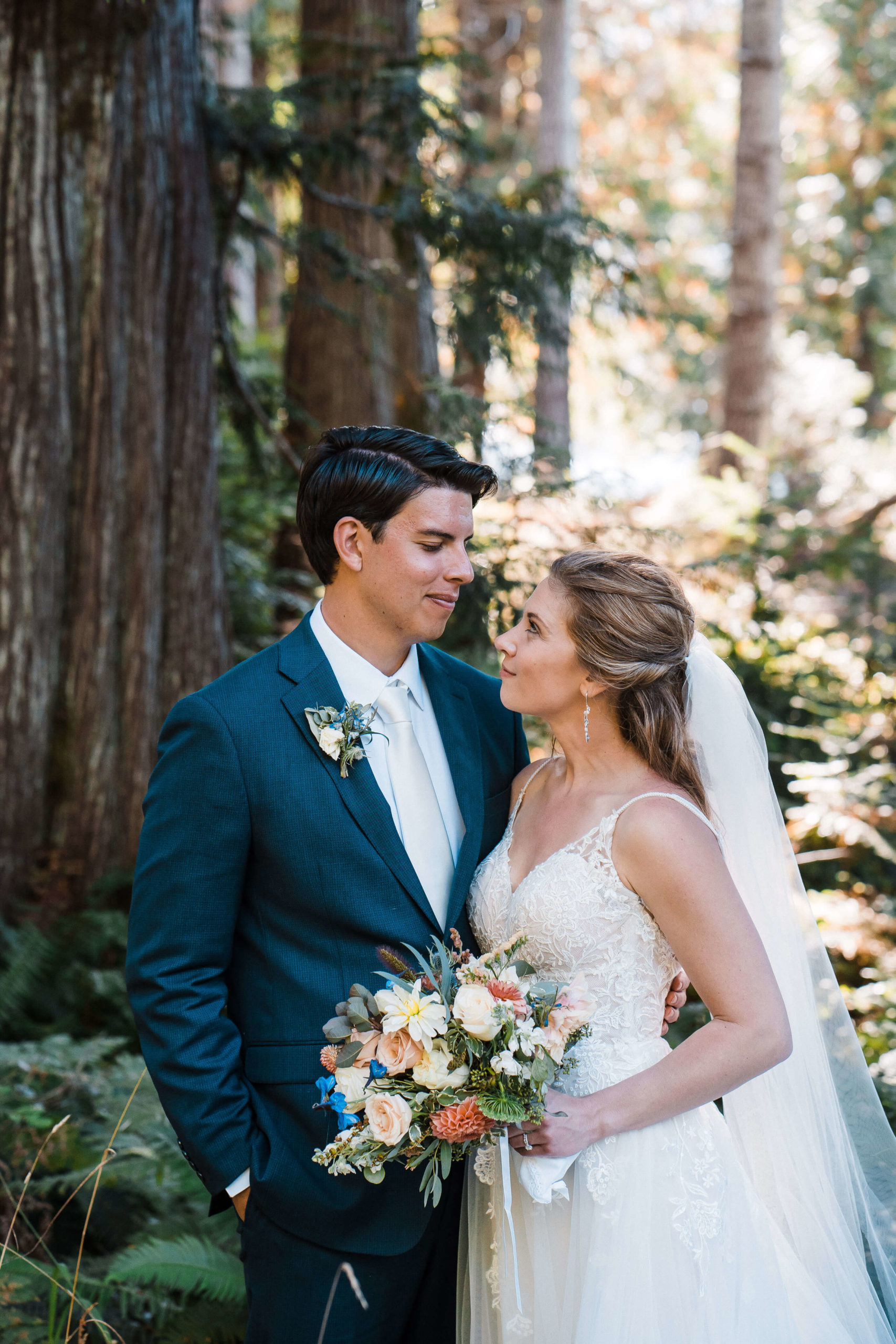 Bride and groom standing in the forest during Olympic National Park elopement