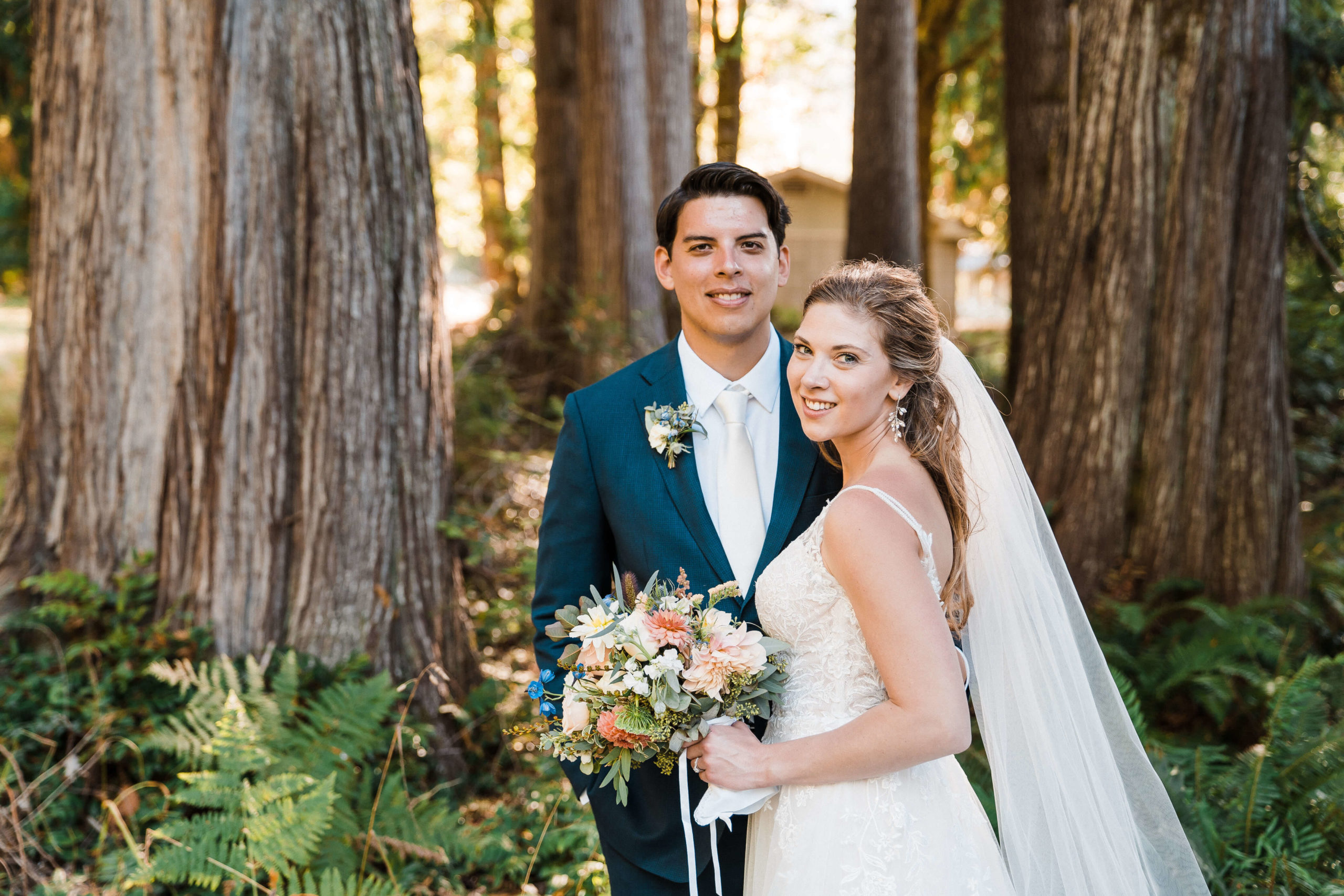Bride and groom standing in the forest during Olympic National Park elopement