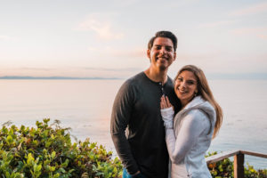 Bride and groom smiling during elopement celebration with family