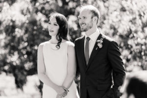 Bride and groom listening to music during outdoor wedding ceremony