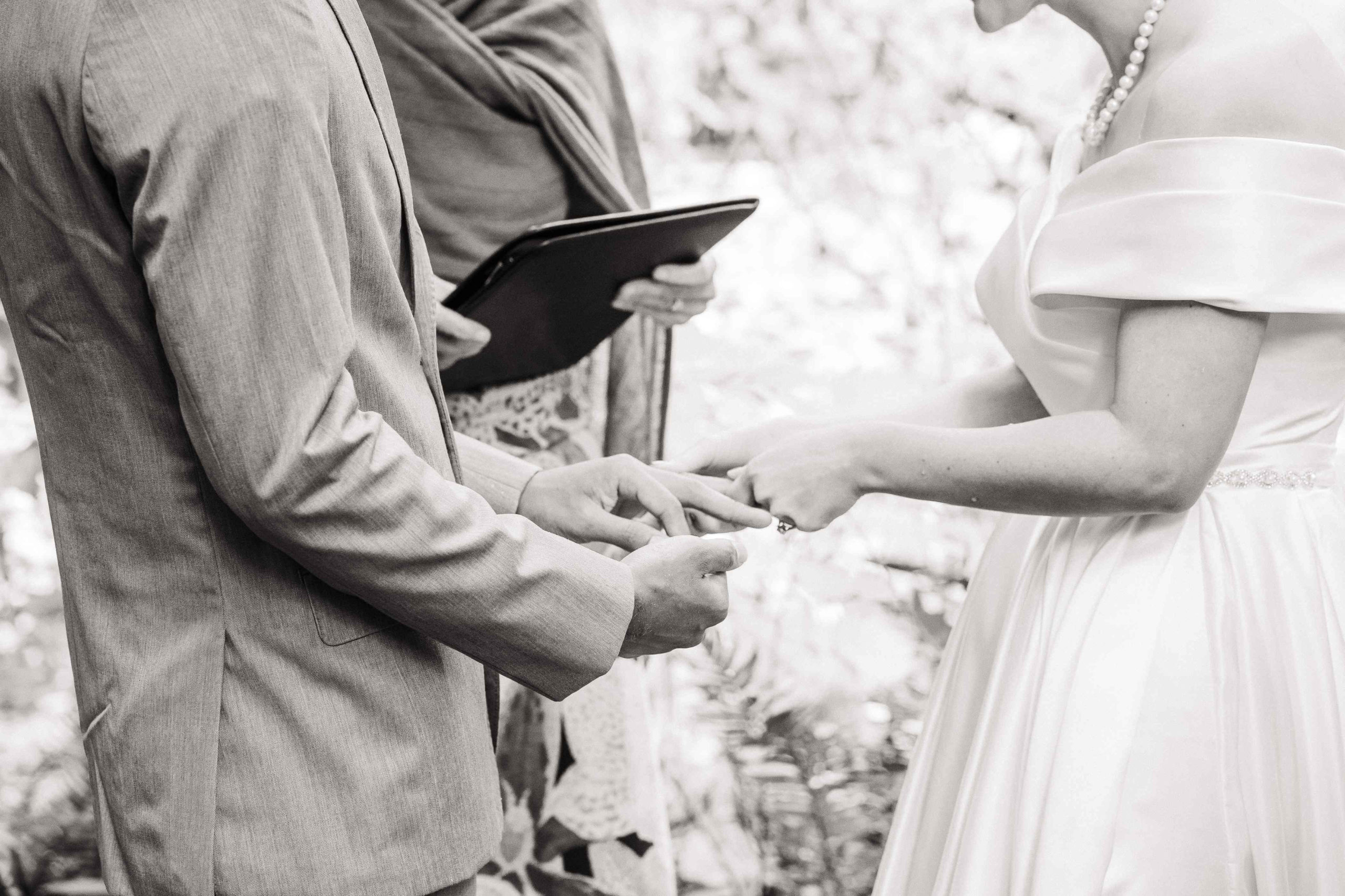 Bride and groom exchange rings at Treehouse Point elopement