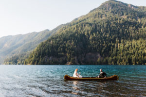 Bride and groom sitting in canoe for their national park wedding photos