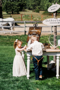 Flower girl and ring bearer at farm wedding