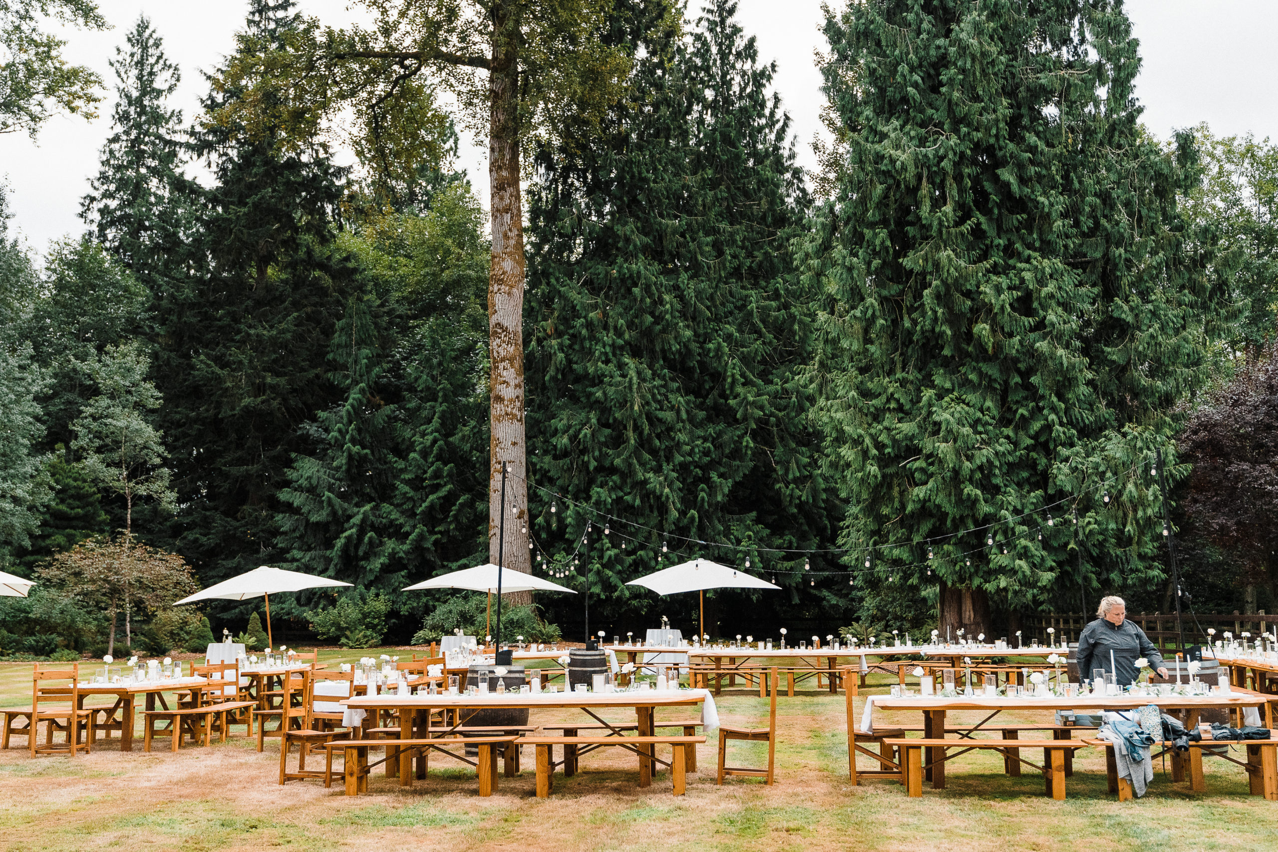 Outdoor wedding reception tables with umbrellas