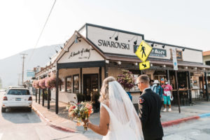 Bride and groom walking to reception venue after their small summer wedding ceremony