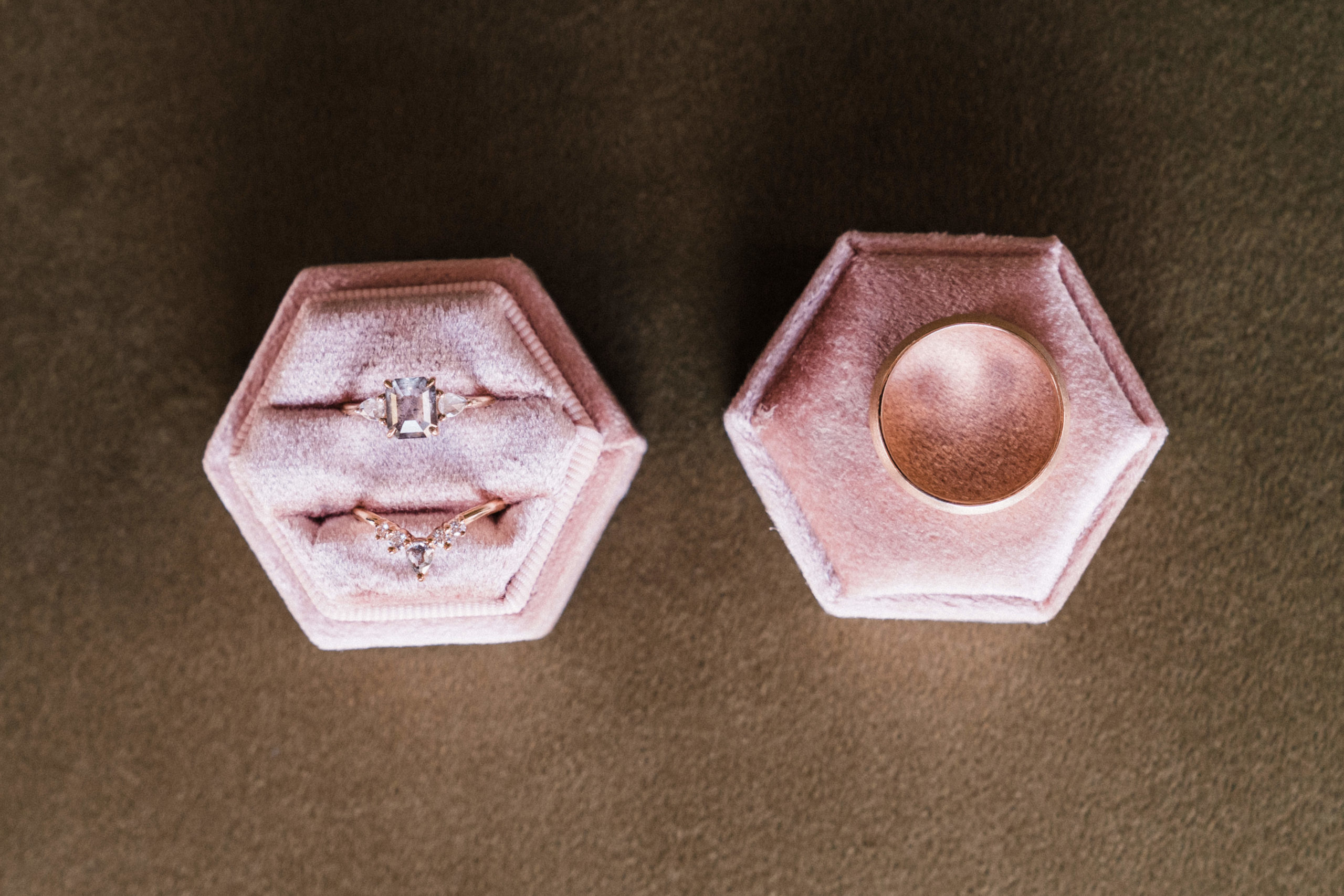 Wedding rings in pink velvet ring boxes
