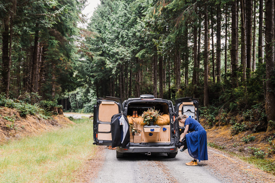 Bride gets ready outside of her camper van for her Olympic National Park Elopement