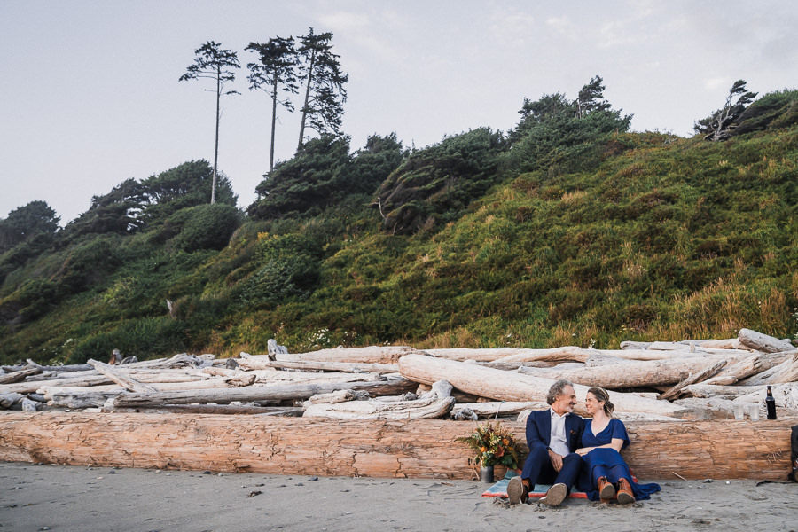 Bride and groom share a beer on the beach together after getting married on Kalaloch Beach