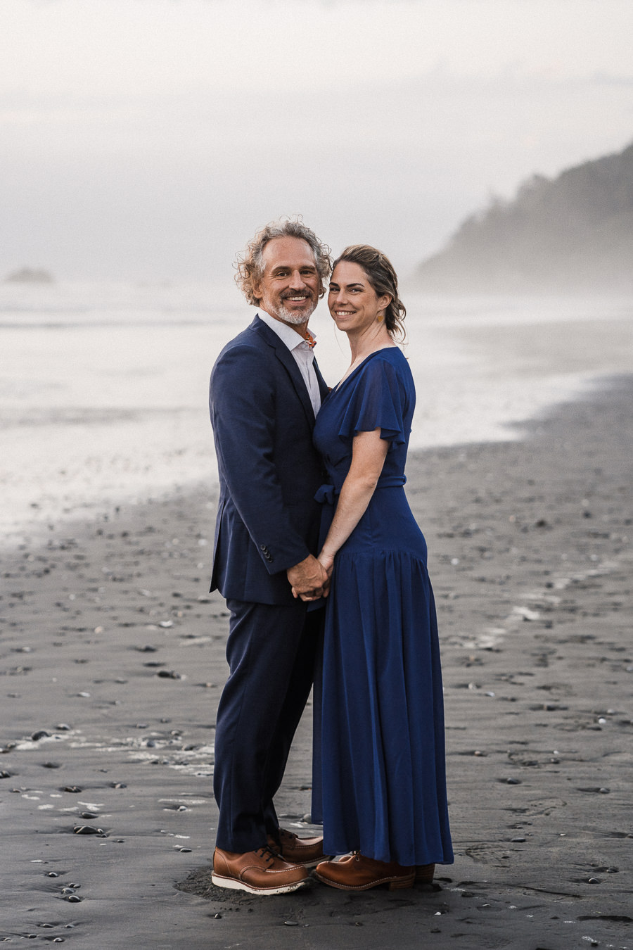 Bride and groom poses together after their Olympic National Park elopement on Kalaloch Beach