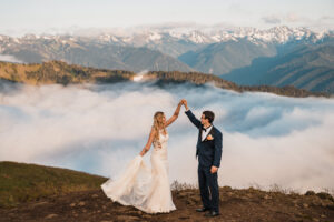 A groom spins his bride during their elopement on top of Hurricane Ridge in Olympic National Park