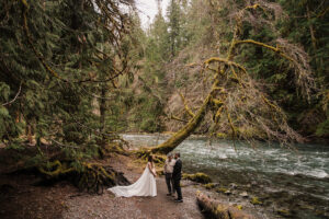 a couple says their vows along the dosewallips river in olympic national park